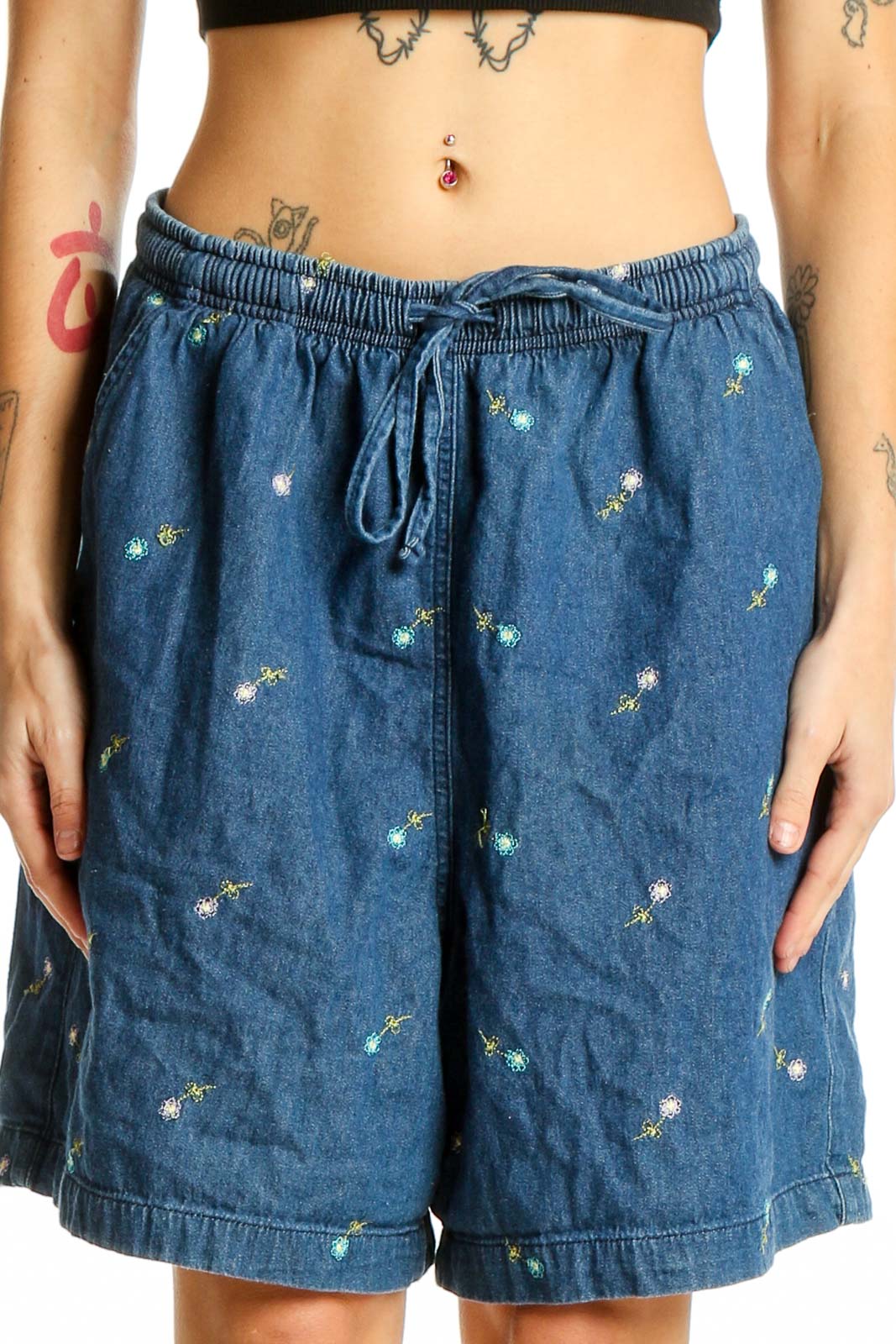 Front view of Erika & Co blue cotton shorts with floral embroidery