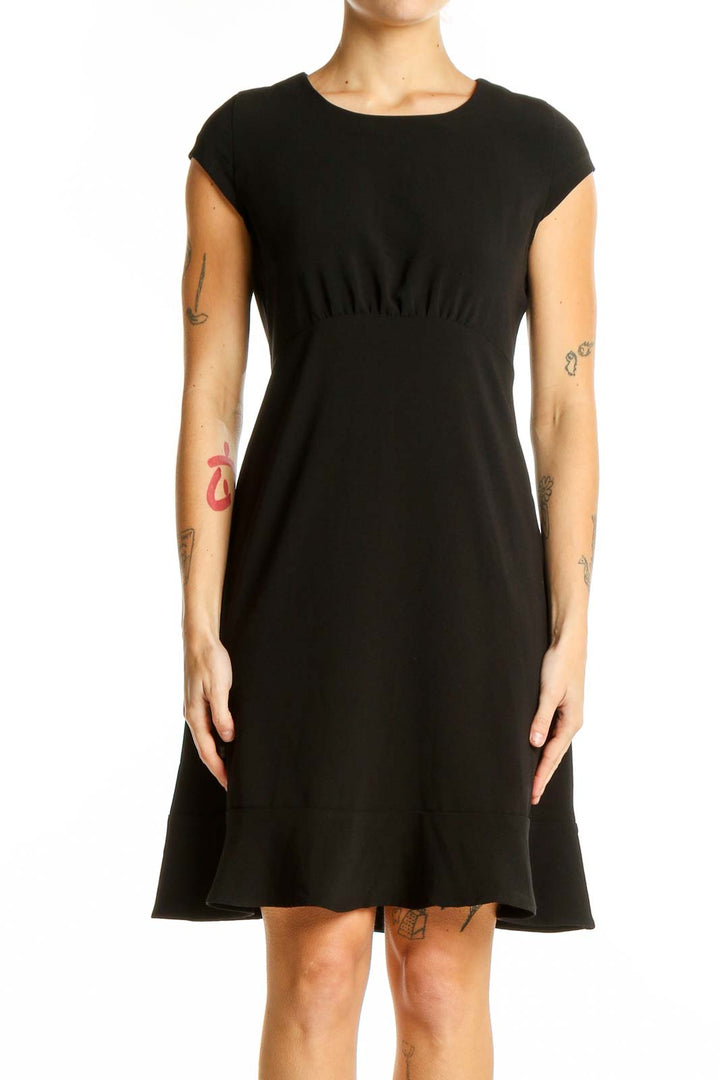 Front view of black Banana Republic cap sleeve dress with empire waist