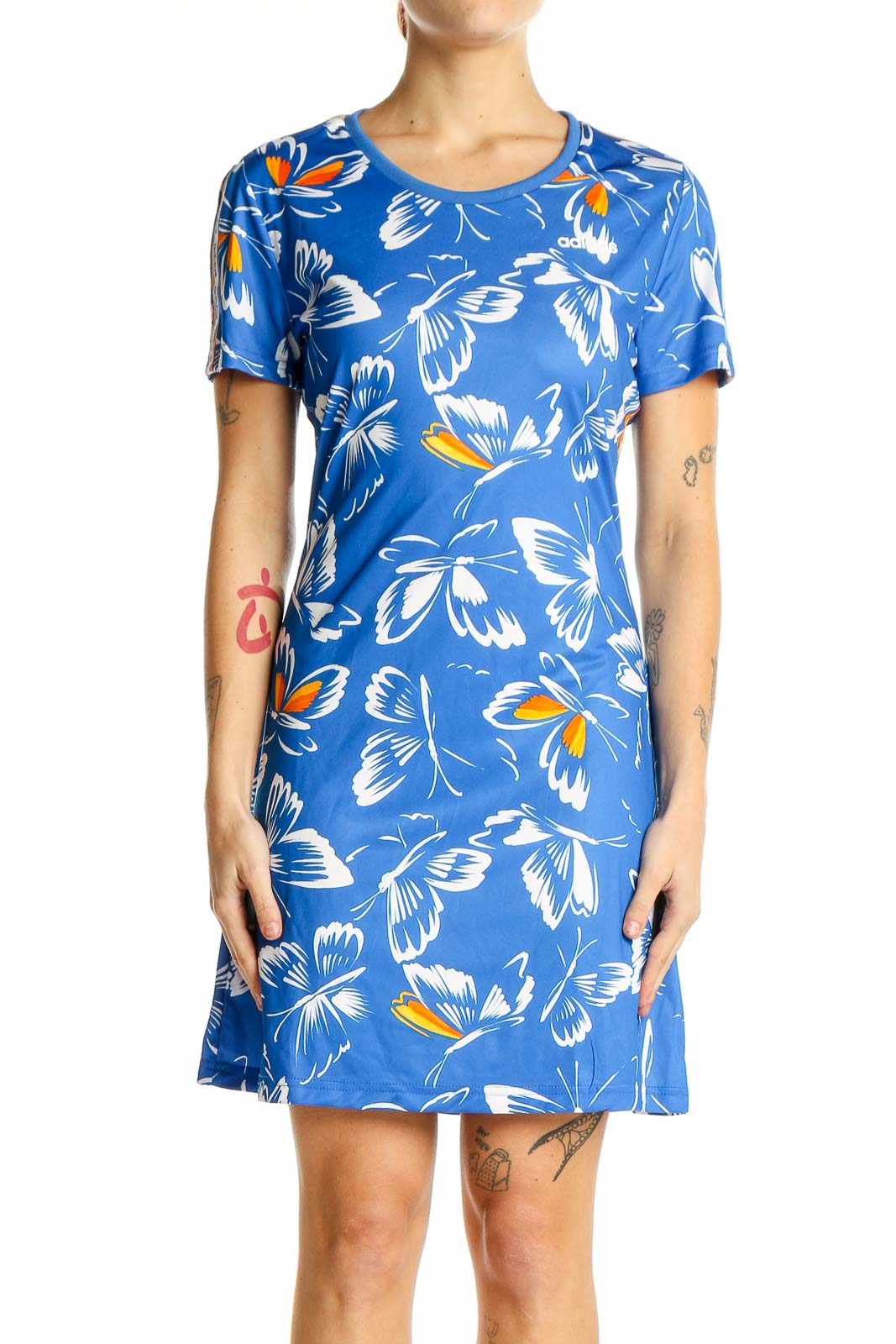 Front view of blue Adidas dress with white and orange butterfly print