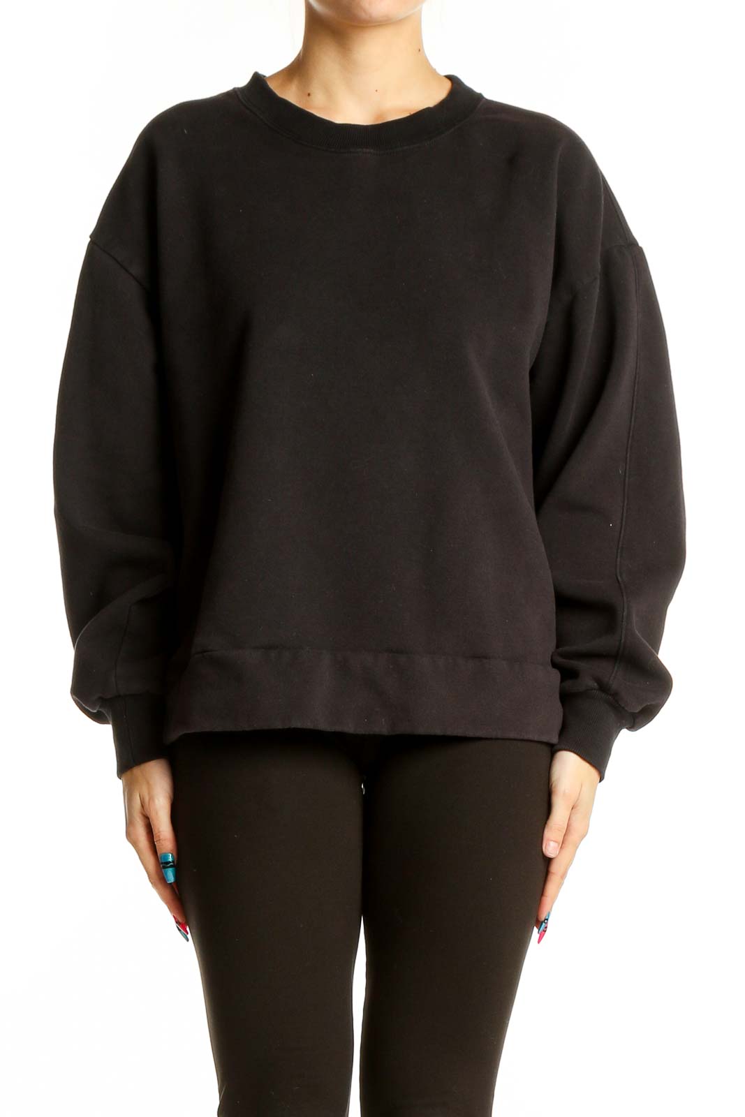 Front view of black oversized Athleta sweatshirt on model