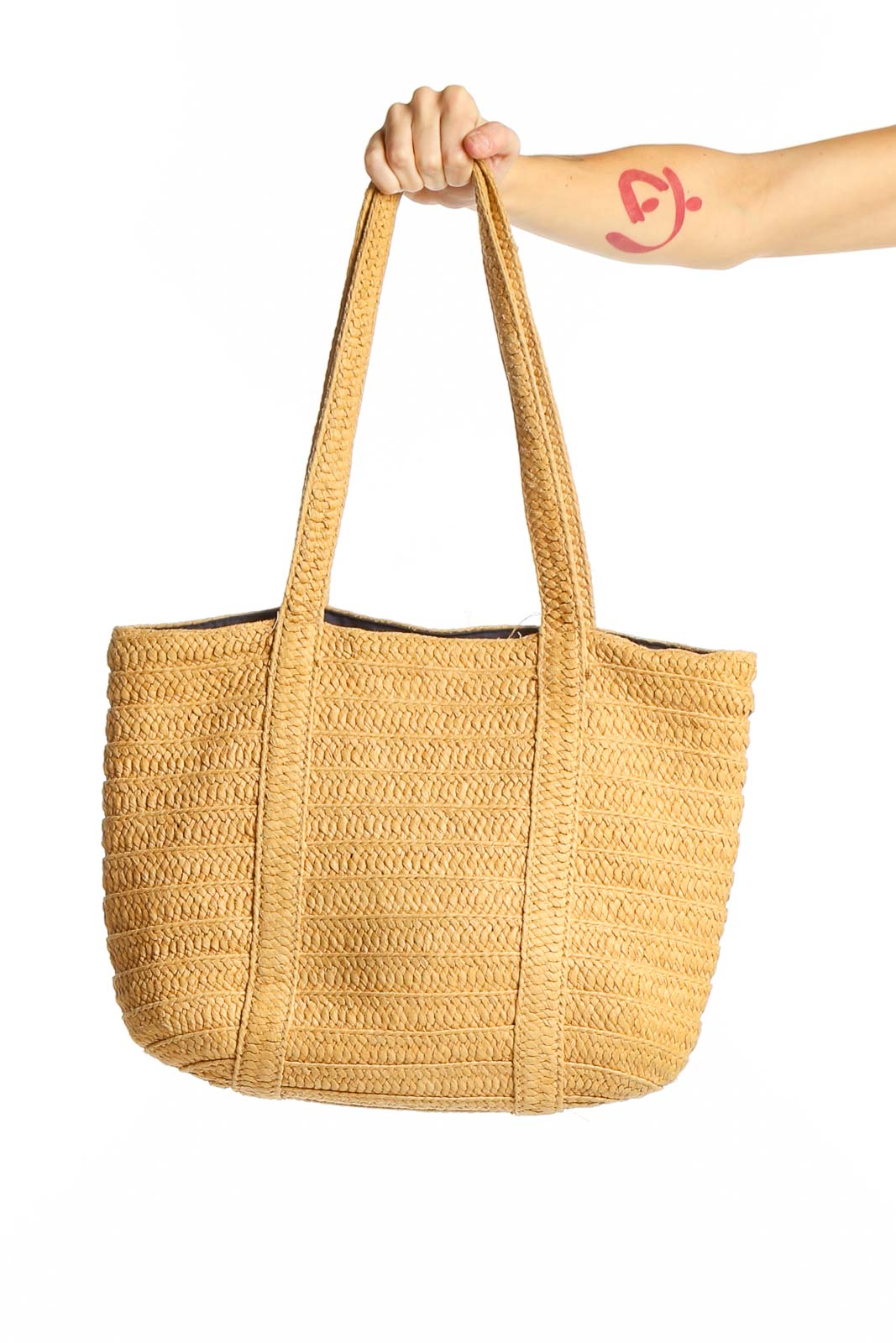 Front view of Draper James tan woven straw tote bag