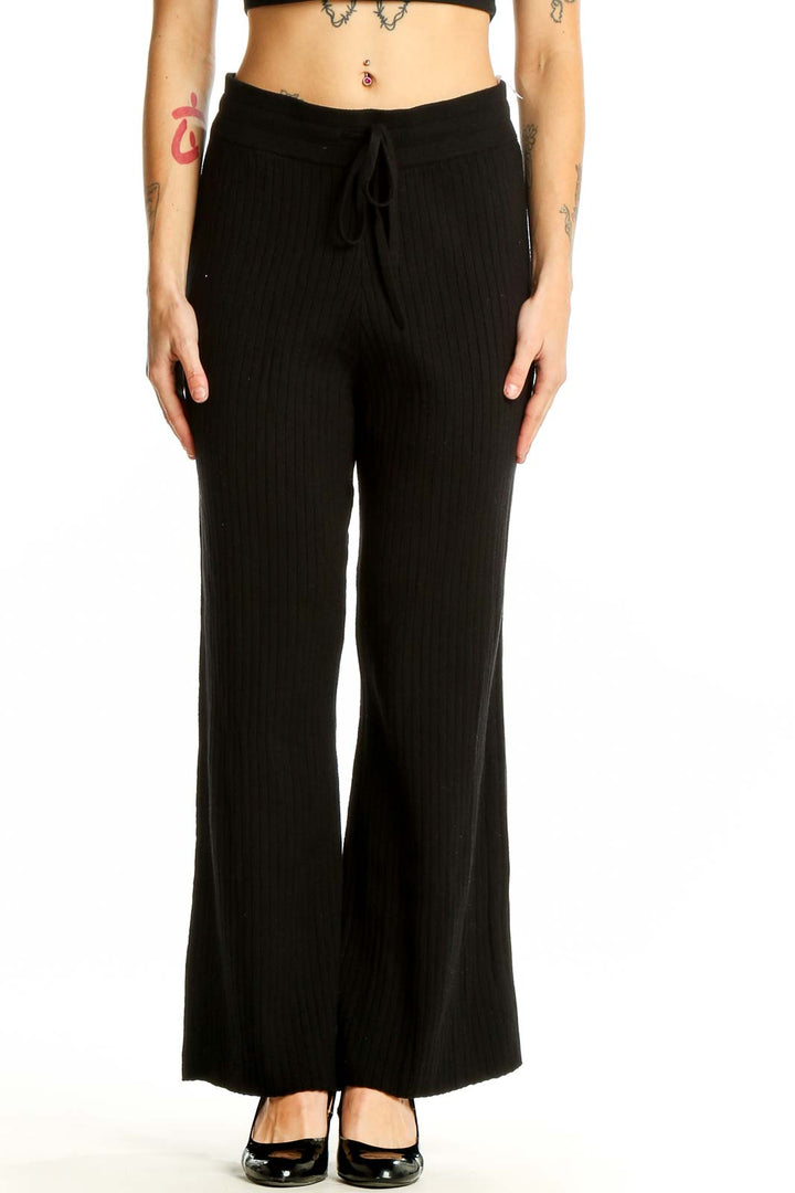 Front view of Victoria's Secret black wide-leg lounge pants with drawstring waist