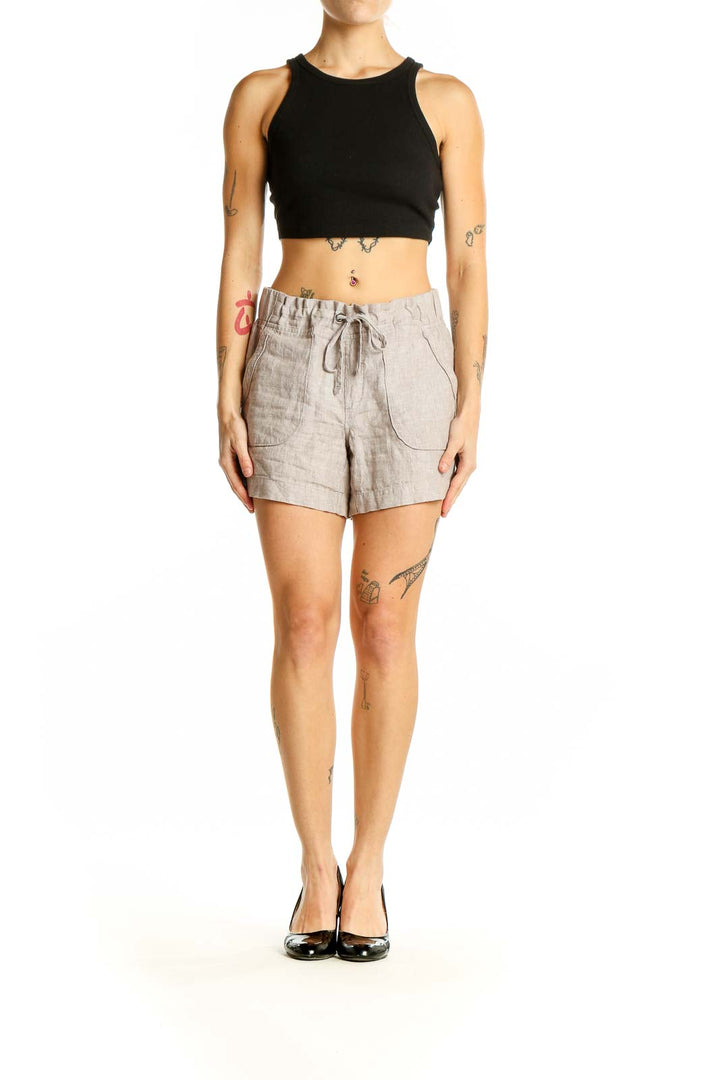 Front view of Athleta beige linen drawstring shorts