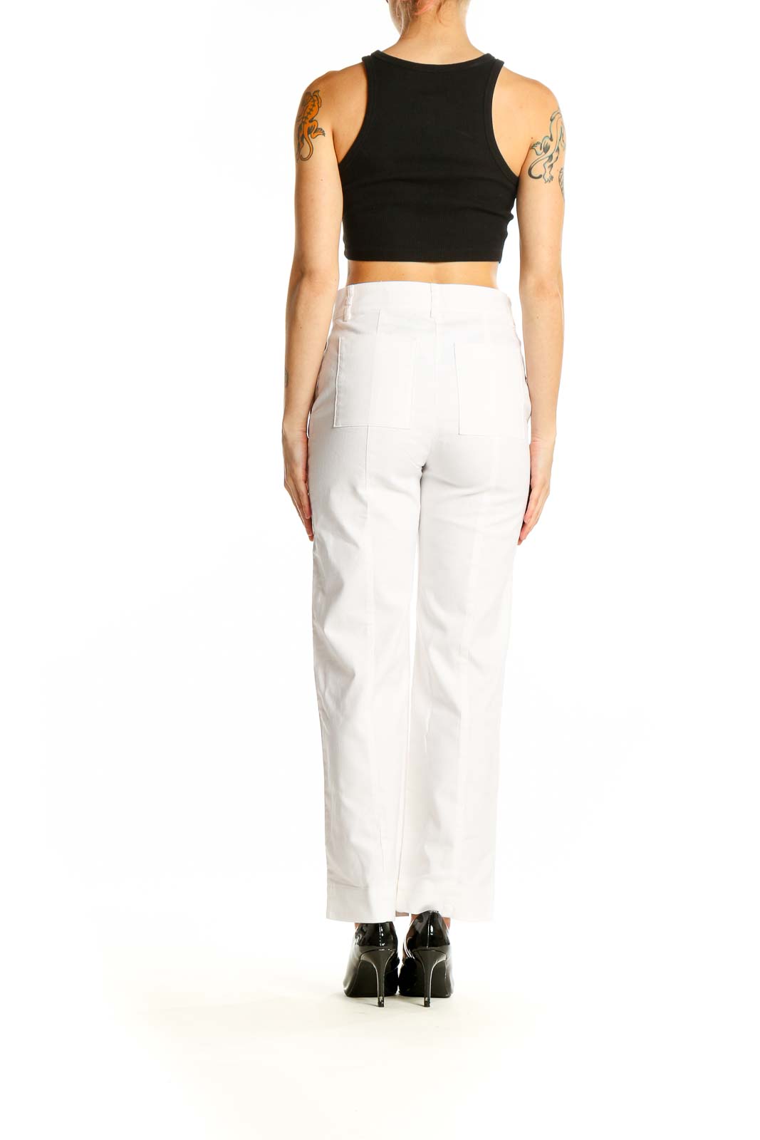 Side view of model wearing white LOFT trousers with black top