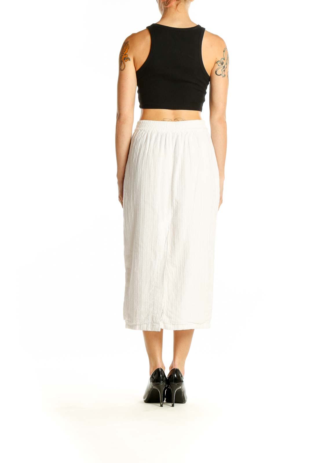 Side view of white cotton button-front midi skirt by DL1961 with black crop top