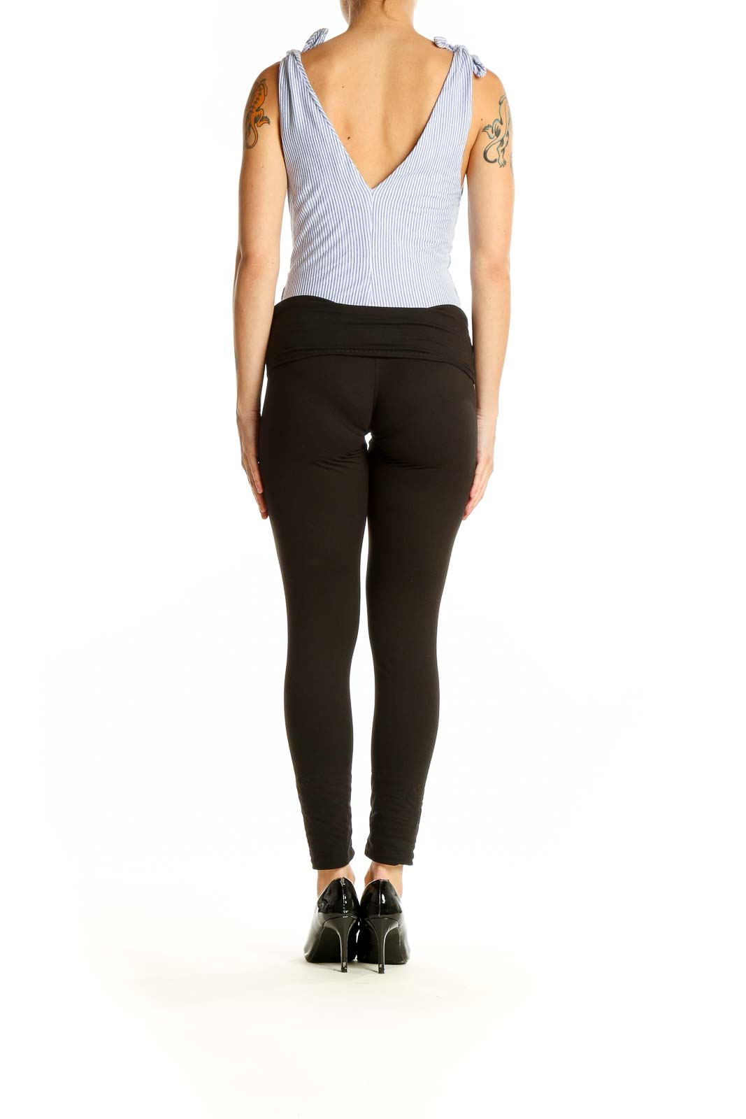 Side view of Zara Basic blue striped cotton tank top with black pants