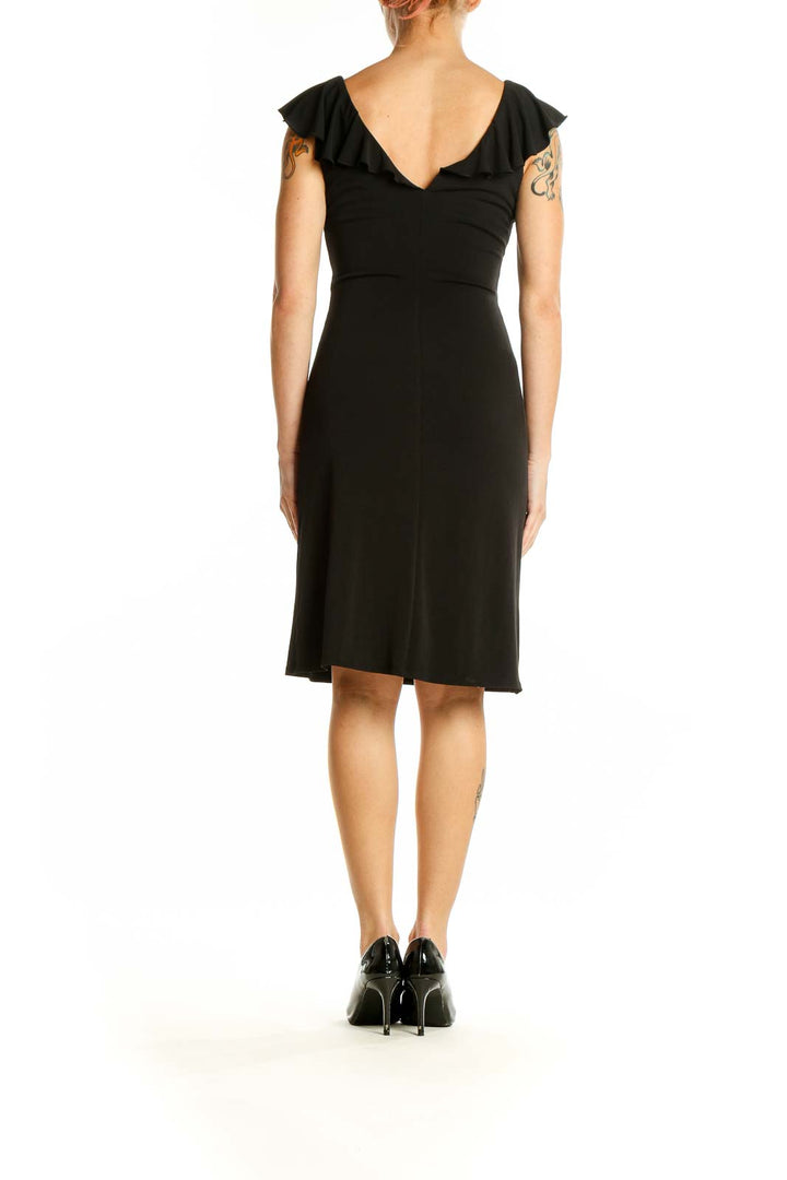 Side view of Black Ruffle-Trim Wrap Dress from White House Black Market