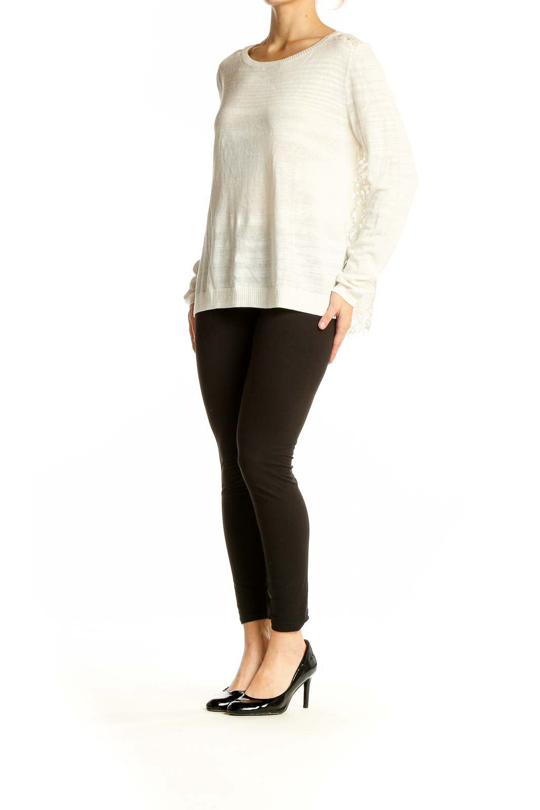 Front view of Cabi cream lightweight knit sweater with lace shoulder details