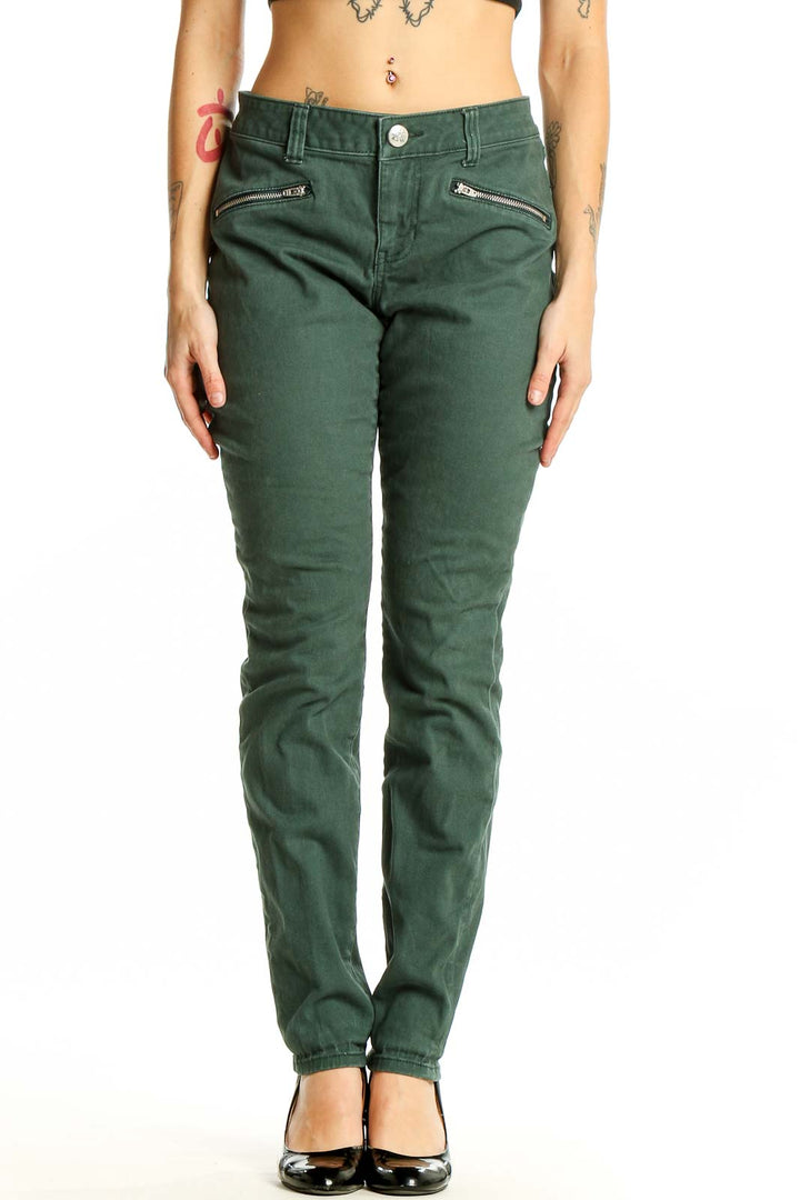 Front view of Cabi green slim fit denim jeans with zipper pockets