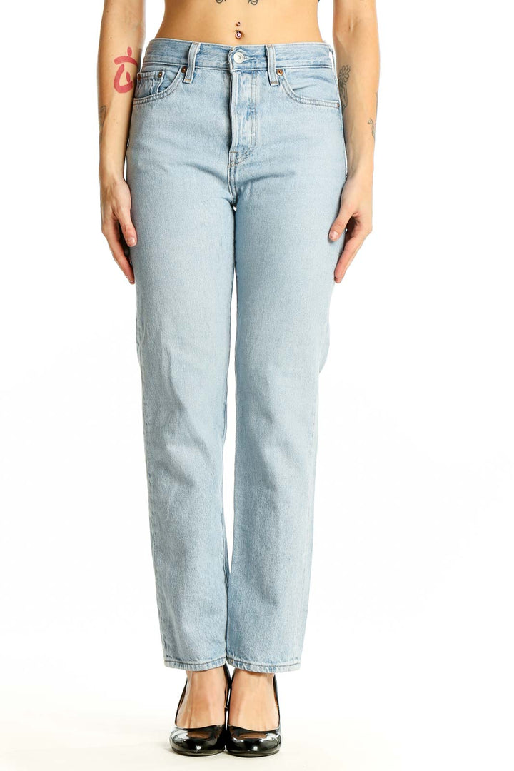 Front view of Levi's light blue straight leg jeans on model