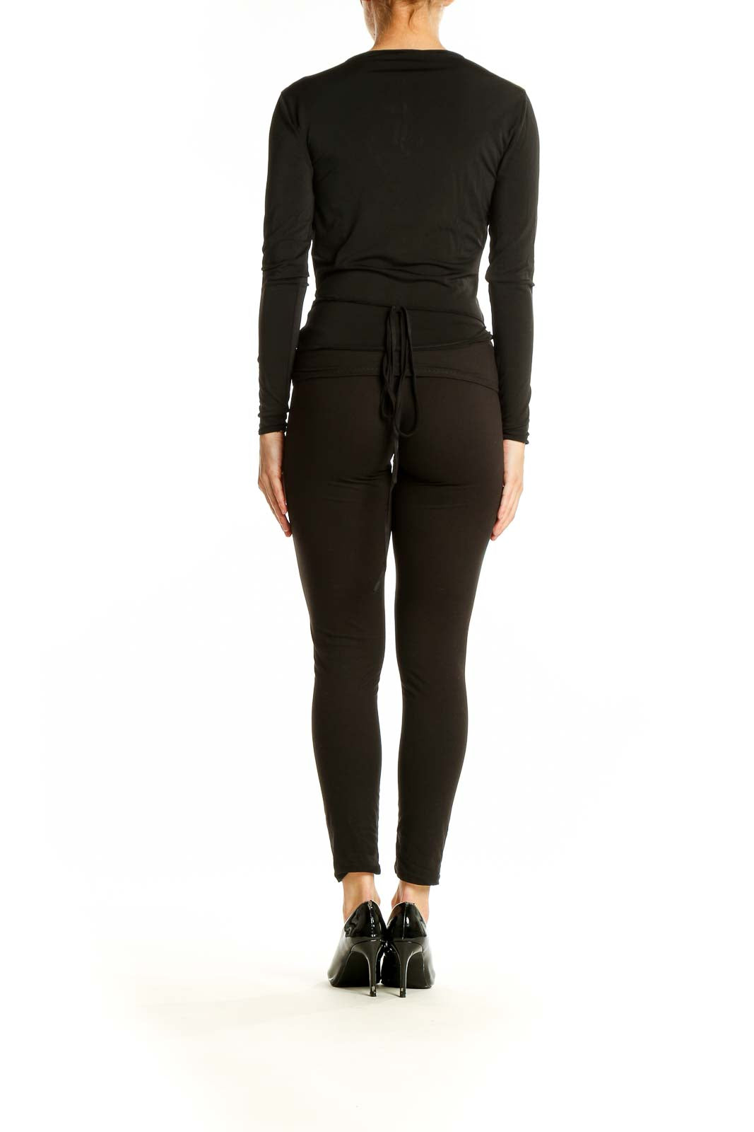 Side view of black wrap-style long sleeve top from Mango on model