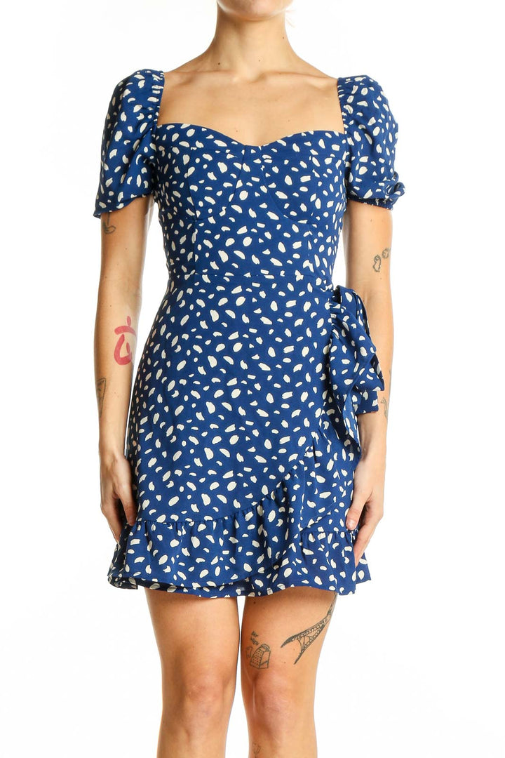 Front view of SilkRoll blue floral print mini wrap dress with puff sleeves