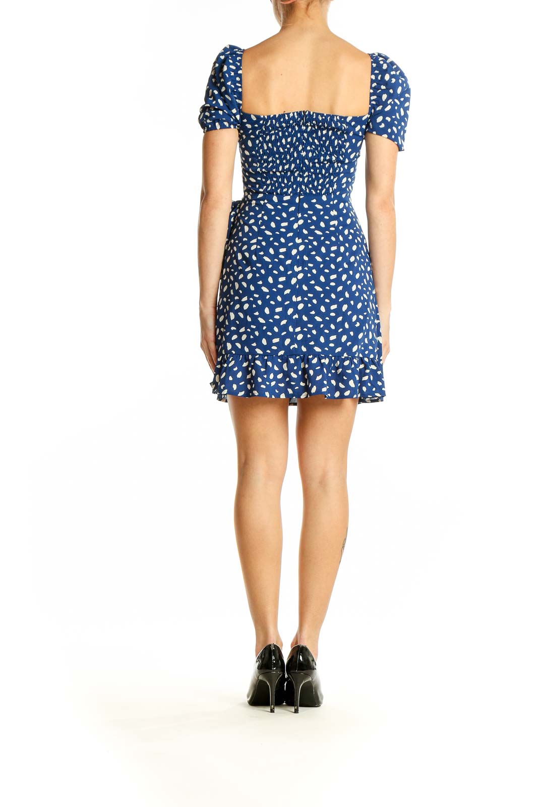 Side view of SilkRoll blue floral print mini wrap dress showing wrap detail