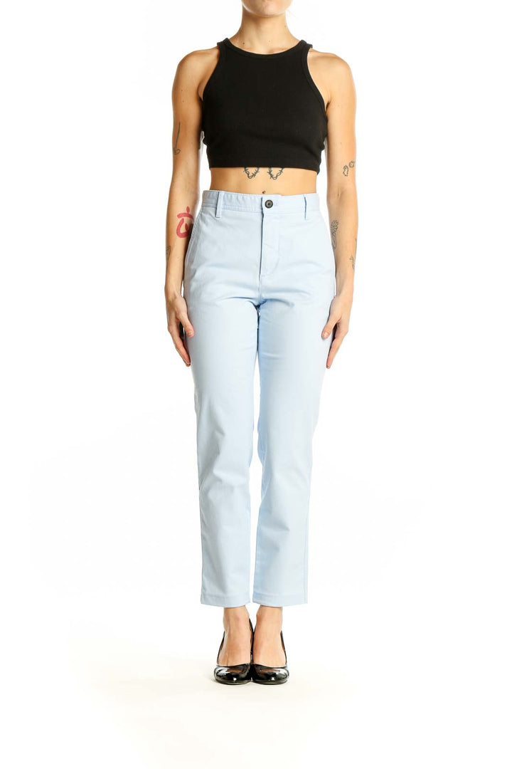 Front view of light blue Banana Republic ankle pants on model