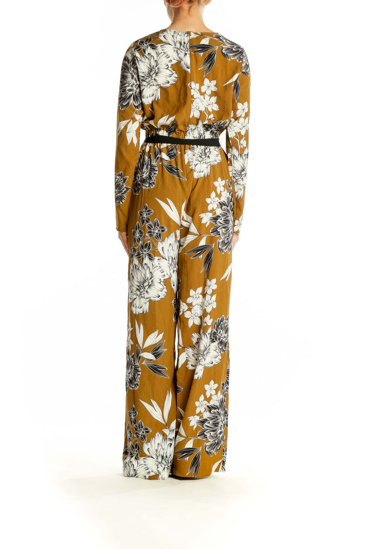 Side view of SilkRoll mustard floral long sleeve jumpsuit showing full-length design