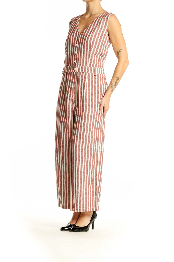 Front view of Boden rust striped sleeveless jumpsuit with V-neck and button-front closure