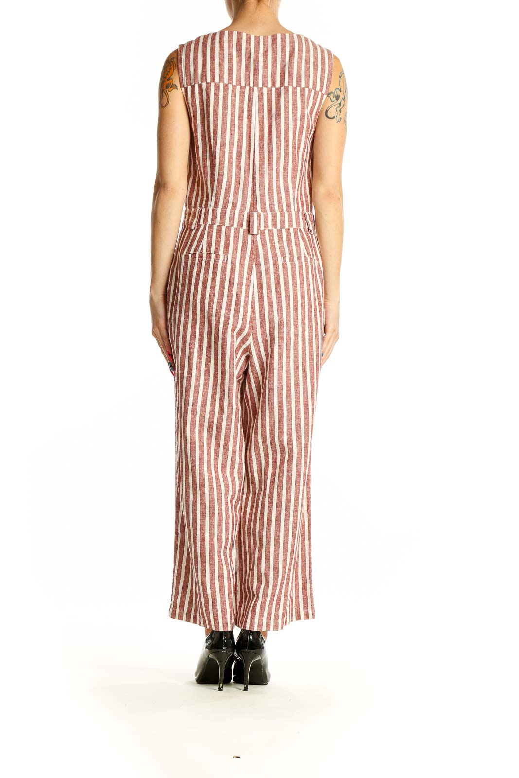 Side view of Boden rust striped wide-leg jumpsuit showing full-length silhouette