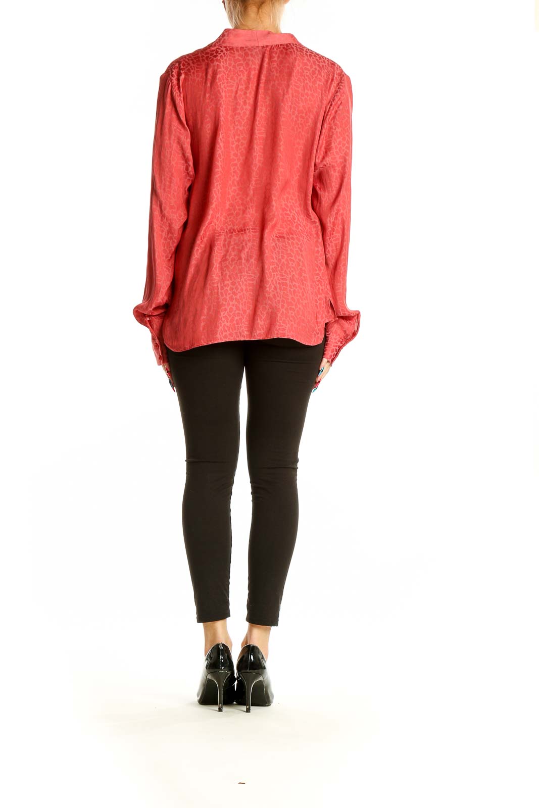 Side view of coral Halogen blouse showing long sleeves and relaxed fit