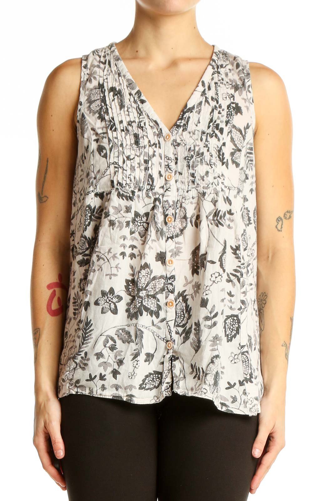 Front view of Maeve white sleeveless top with gray floral print and button-front closure