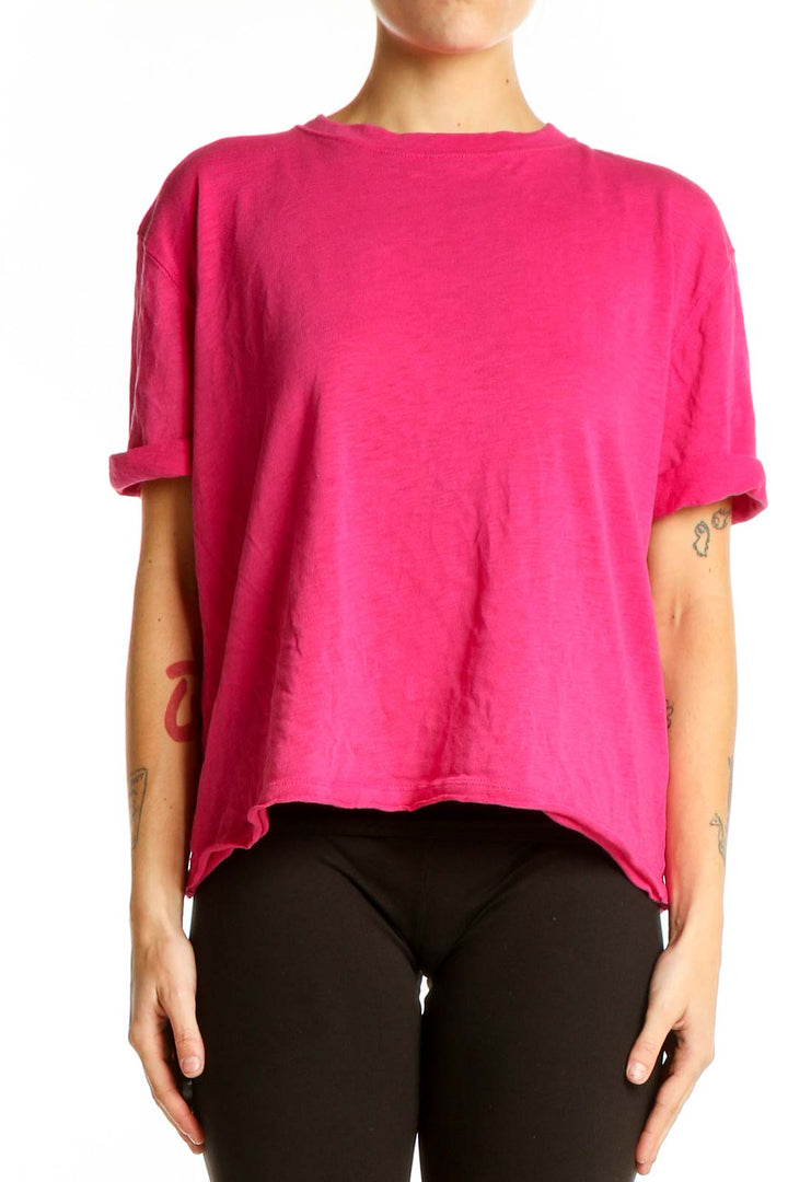 Front view of WE THE FREE hot pink oversized t-shirt on model