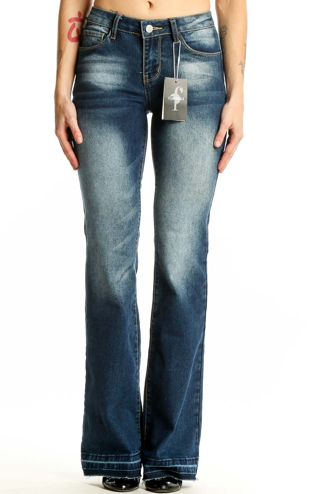 Front view of Flamingals blue faded flare jeans on model