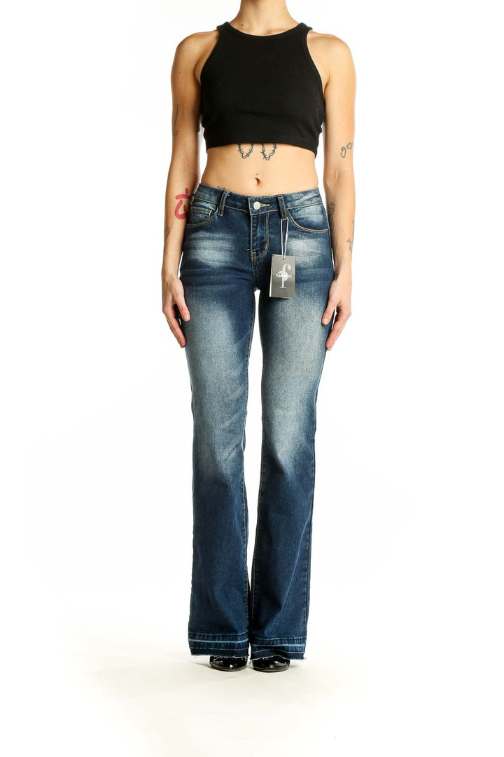 Front view of Flamingals blue faded flare jeans on model