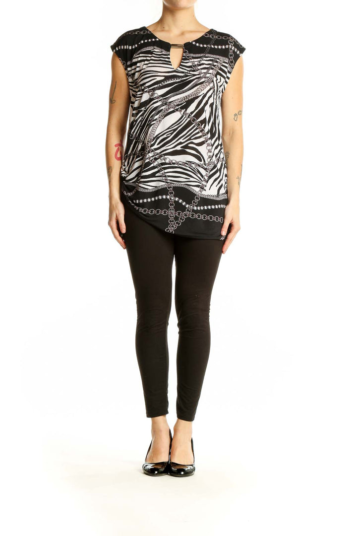 Front view of Cache black and white zebra print sleeveless top with chain pattern