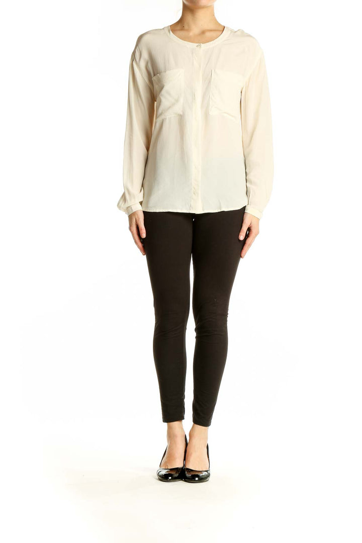 Front view of Everlane ivory silk long-sleeve blouse with patch pockets