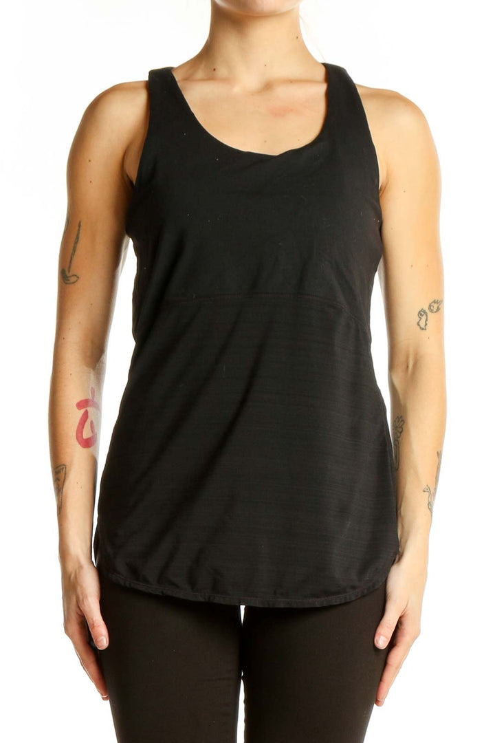 Front view of black Athleta performance tank top with racerback design