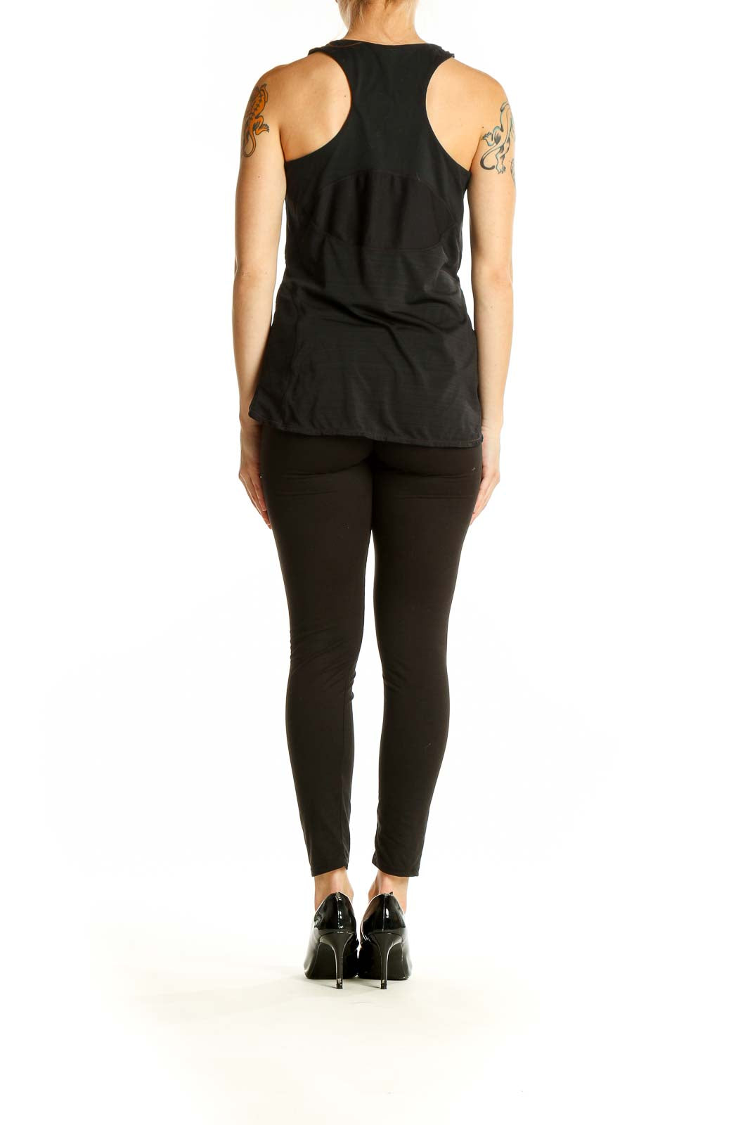 Back view of black Athleta performance tank top showcasing racerback style