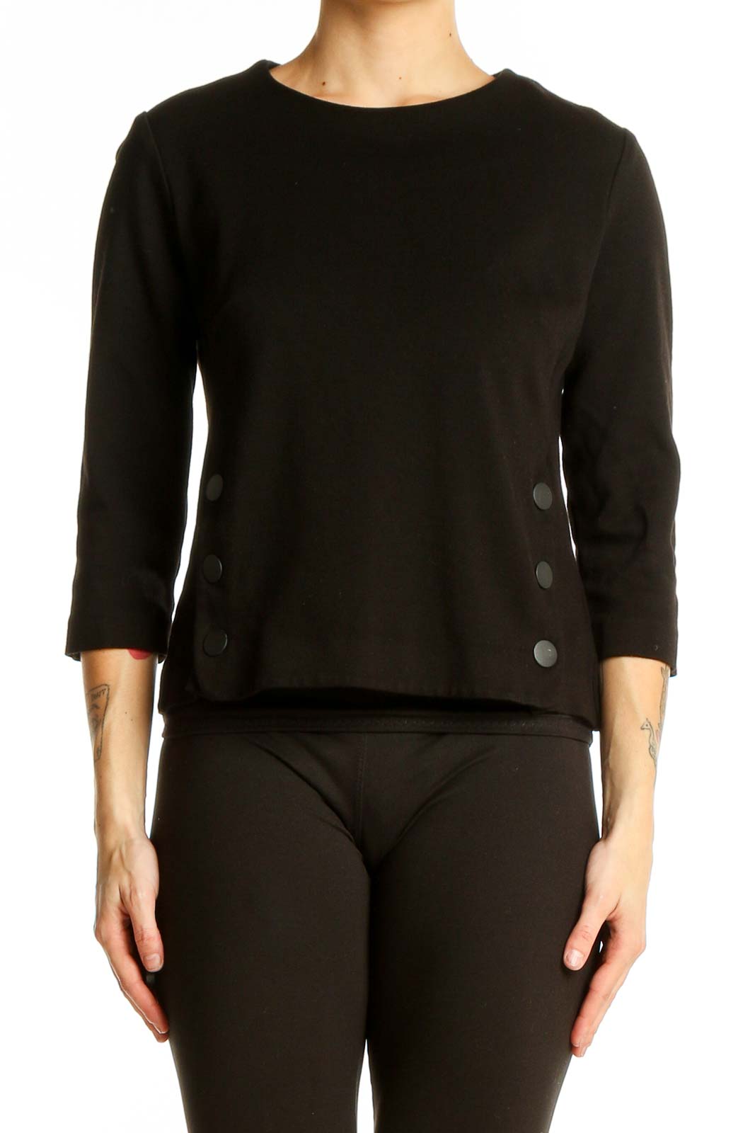 Front view of black Cabi top with 3/4 sleeves and side button details