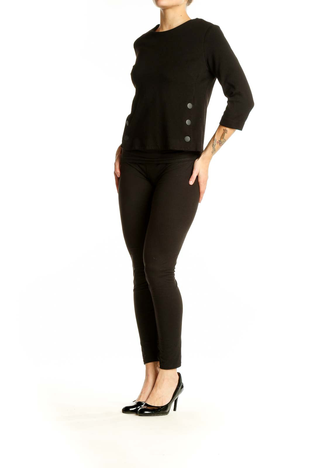 Front view of black Cabi top with 3/4 sleeves and side button details