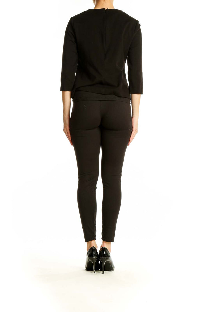 Back view of black Cabi top showing sleek design and fit