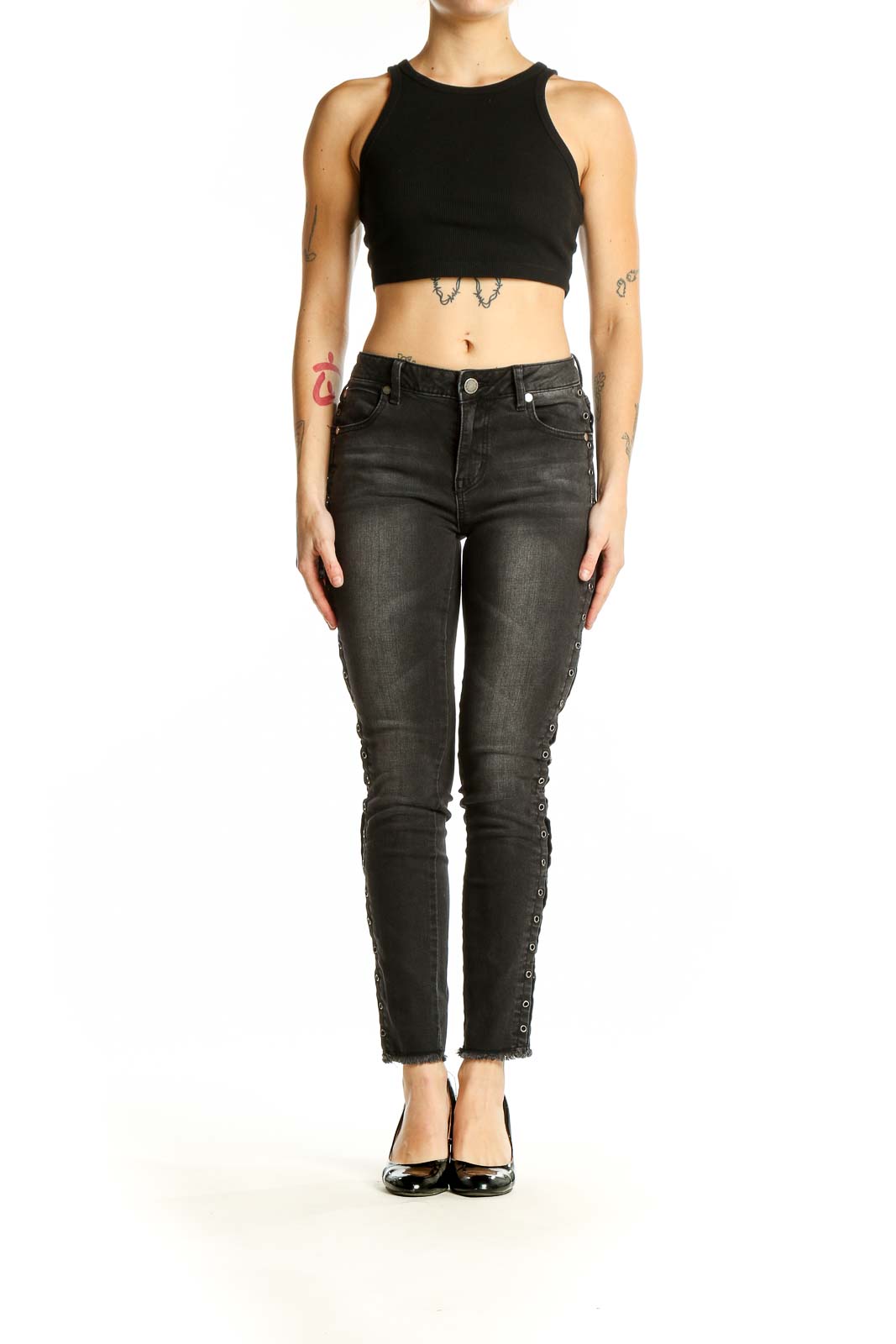 Front view of black distressed skinny jeans with lace-up sides