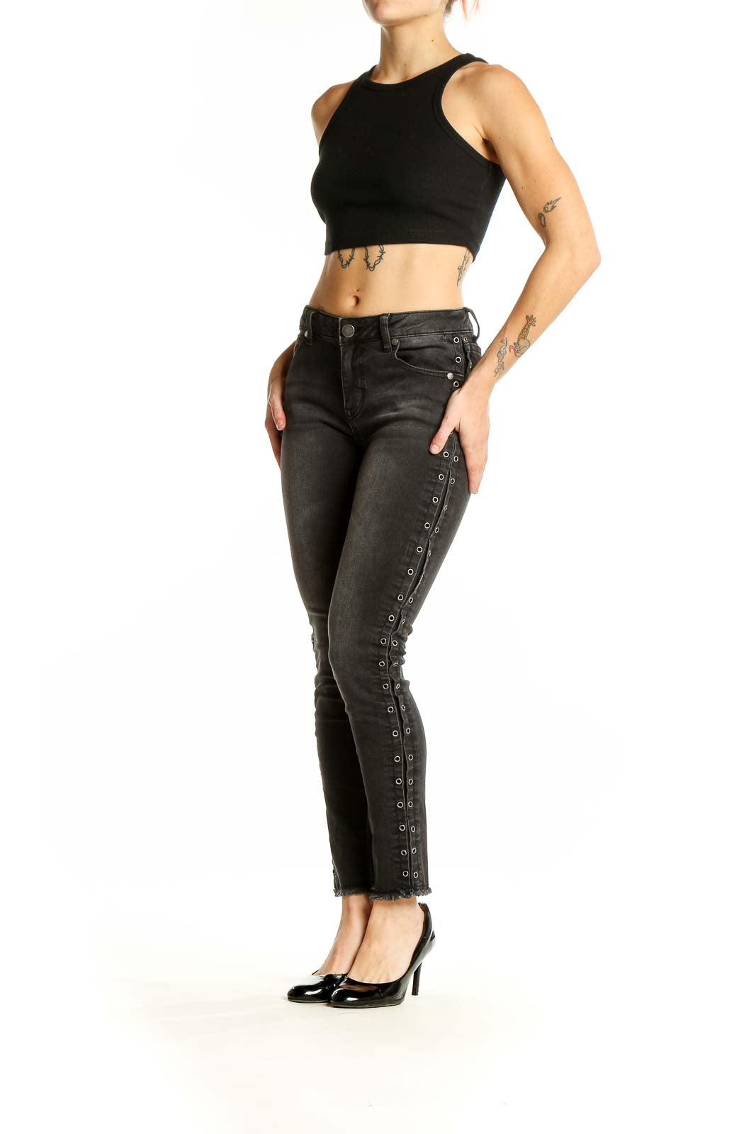 Front view of black distressed skinny jeans with lace-up sides