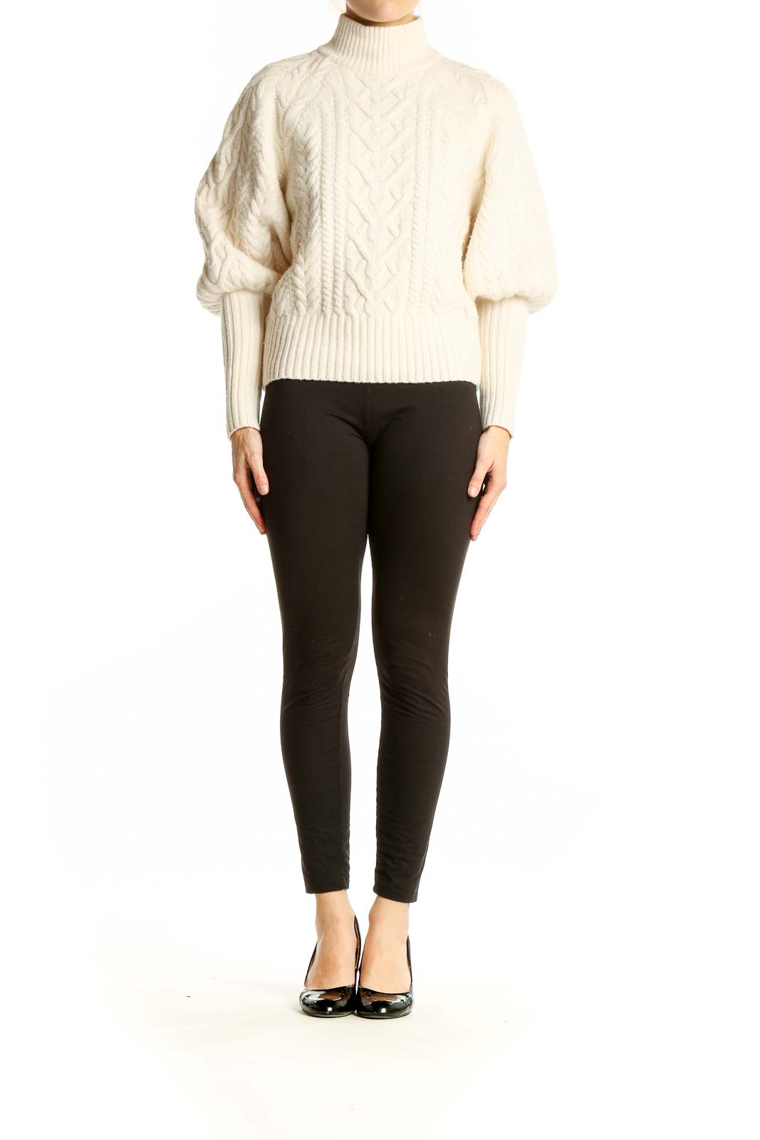 Front view of BCBG MaxAzria cream cable knit turtleneck sweater with balloon sleeves