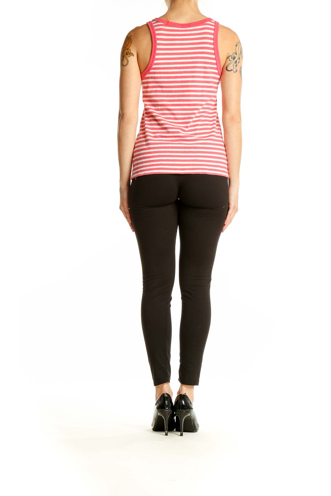 Side view of model wearing J.Crew pink striped tank top with black pants