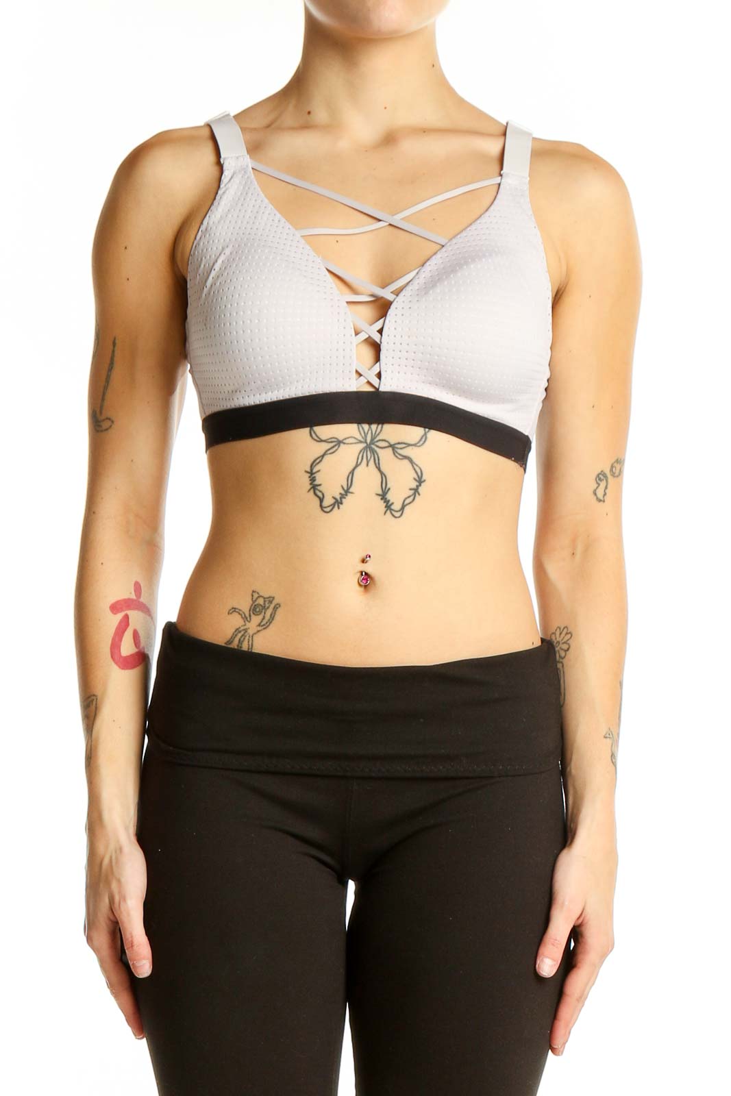 Front view of white Victoria Sport strappy sports bra with textured fabric