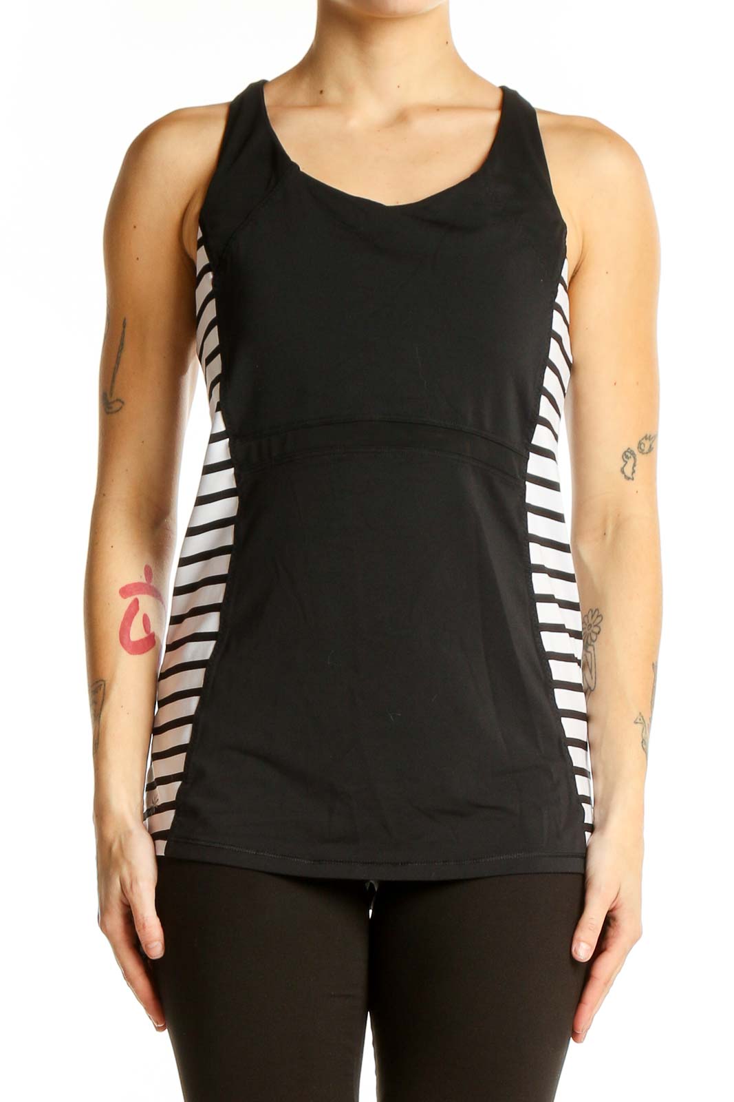 Front view of black Athleta tank top with white side stripes