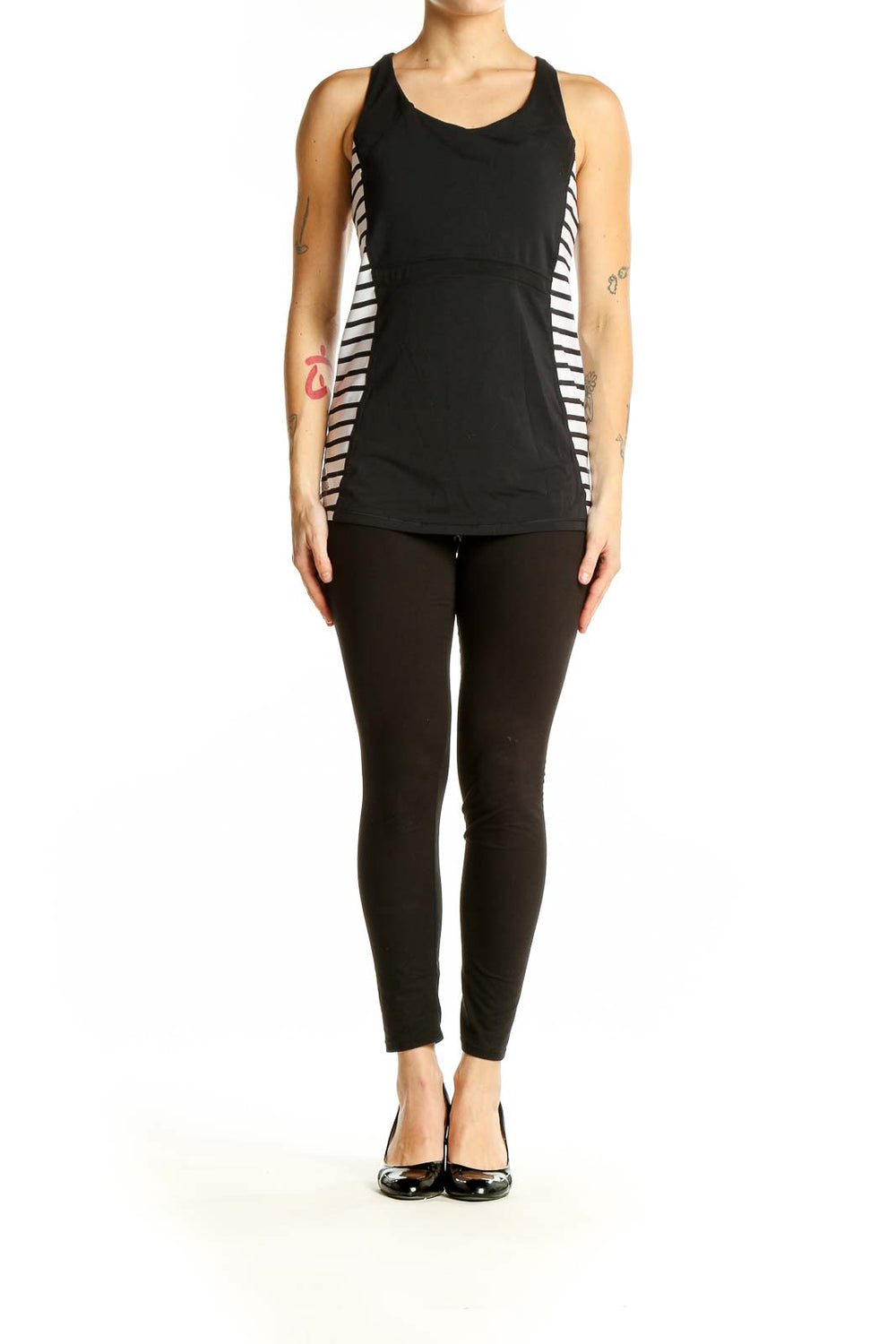 Front view of black Athleta tank top with white side stripes