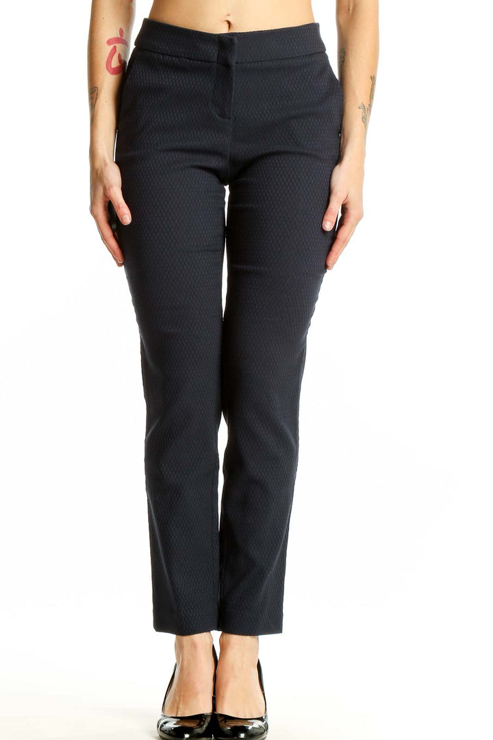 Front view of Dalia black textured slim fit trousers on model