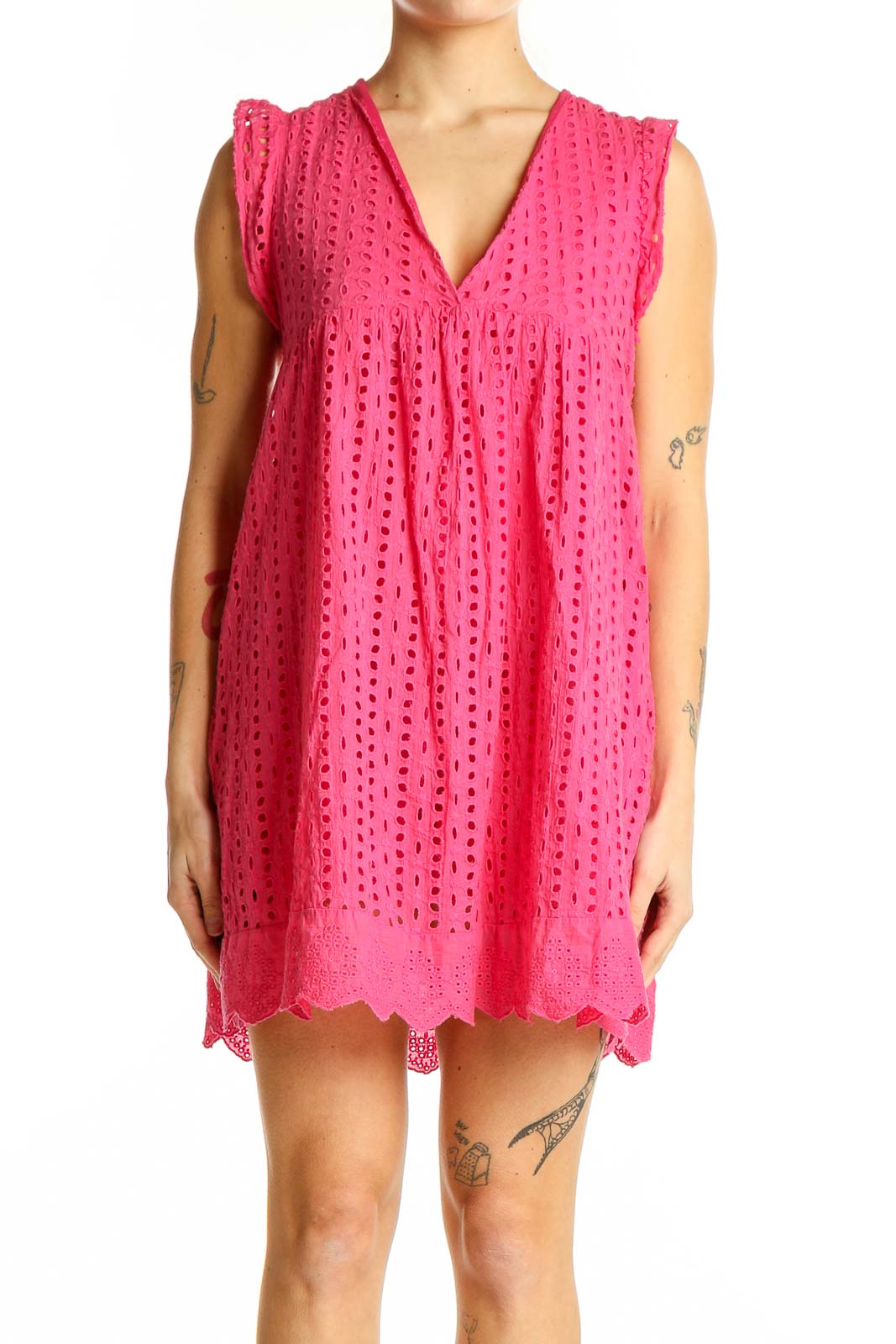 Front view of pink eyelet lace mini dress with V-neck and scalloped hem