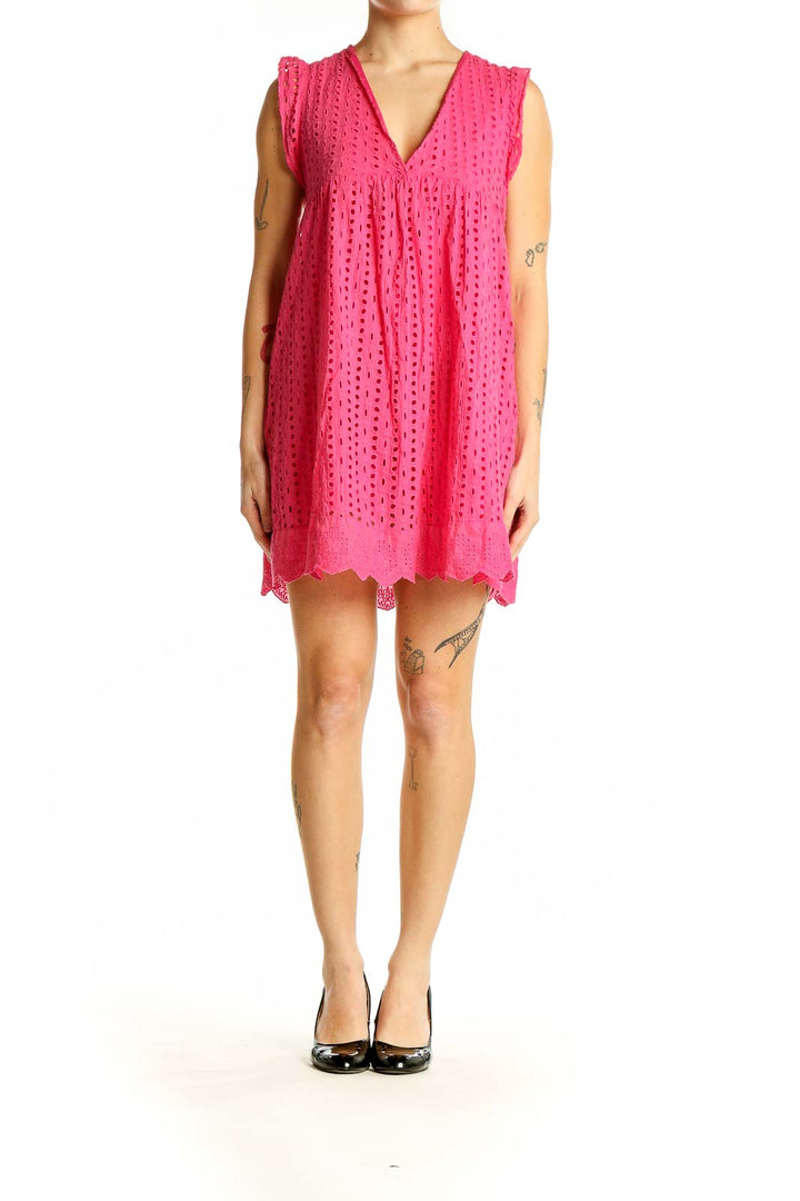 Front view of pink eyelet lace mini dress with V-neck and scalloped hem