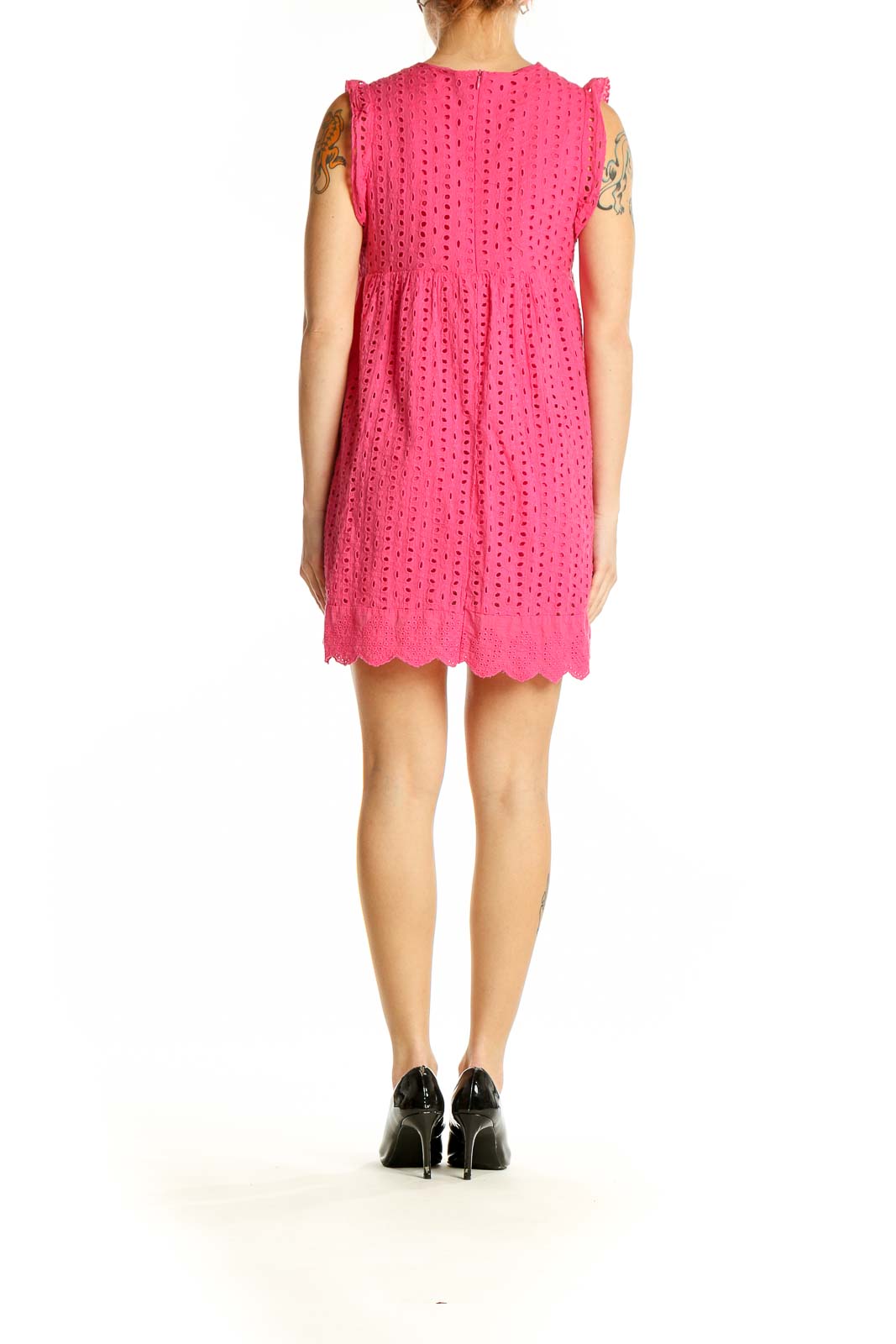 Side view of pink eyelet lace mini dress showing sleeveless design and relaxed fit