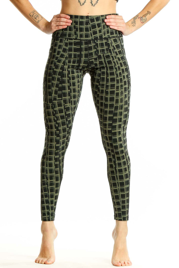 Front view of olive green Calvin Klein activewear leggings with geometric print