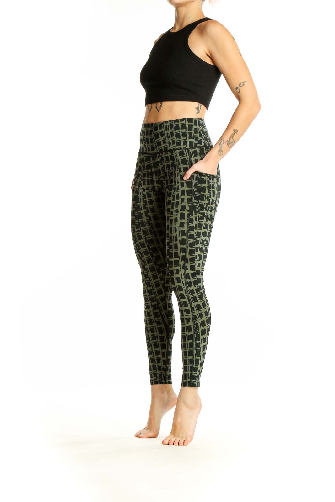 Front view of olive green Calvin Klein activewear leggings with geometric print