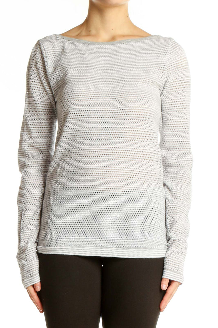 Front view of gray textured long sleeve athletic top by Athleta