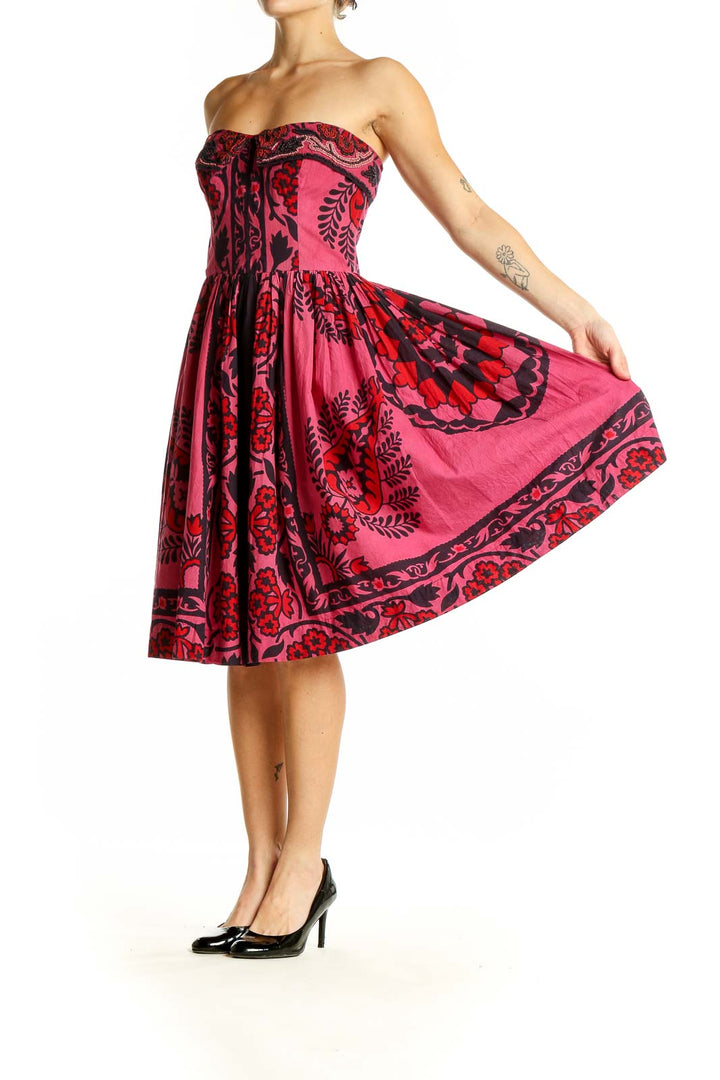 Front view of pink strapless Baraschi dress with black floral pattern