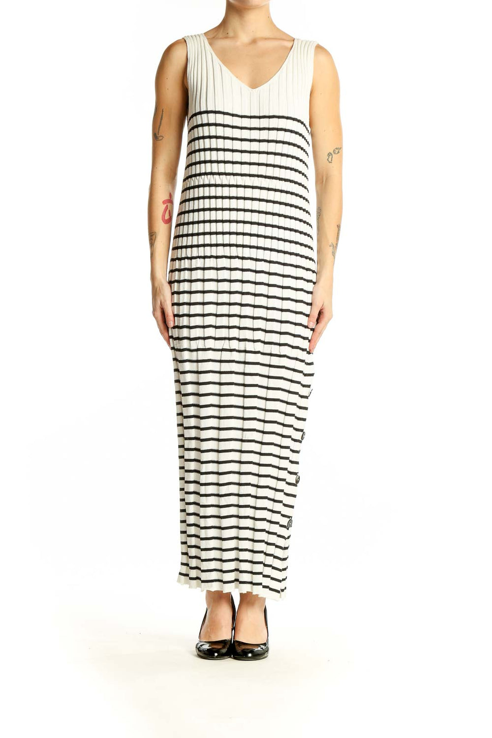 Front view of Qualite white and black striped maxi dress with V-neck