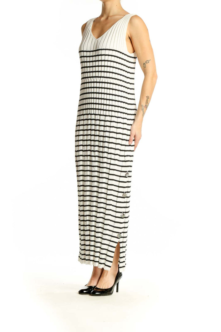 Front view of Qualite white and black striped maxi dress with V-neck